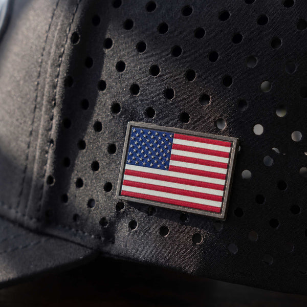 Raised On It | America 250 | Blackout Performance Hat — American Flag
