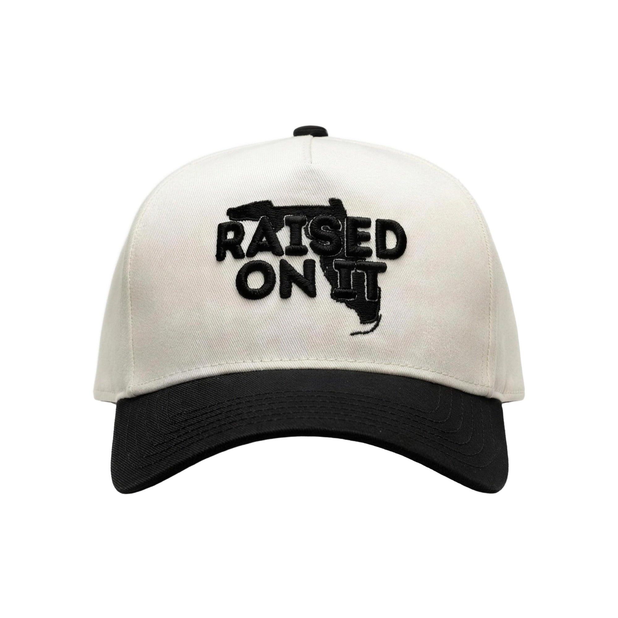 Raised On It Florida Logo embroidered trucker hat in White/Black, canvas white crown, black bill, black Florida logo stitch